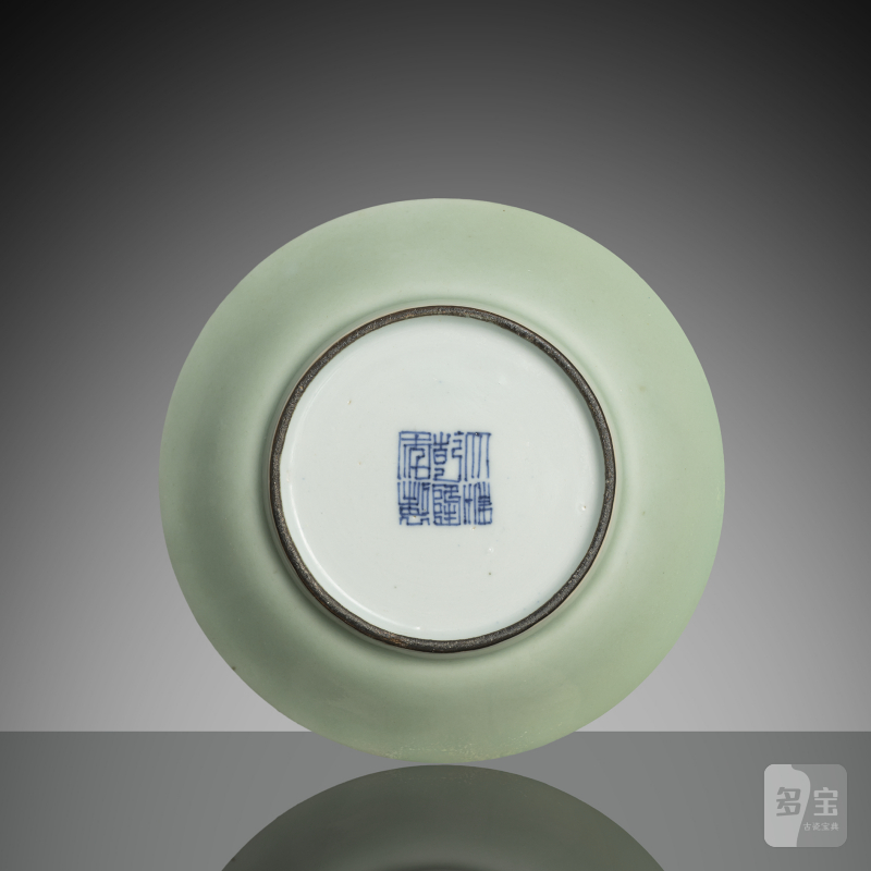 A small celadon-coloured glazed porcelain plate